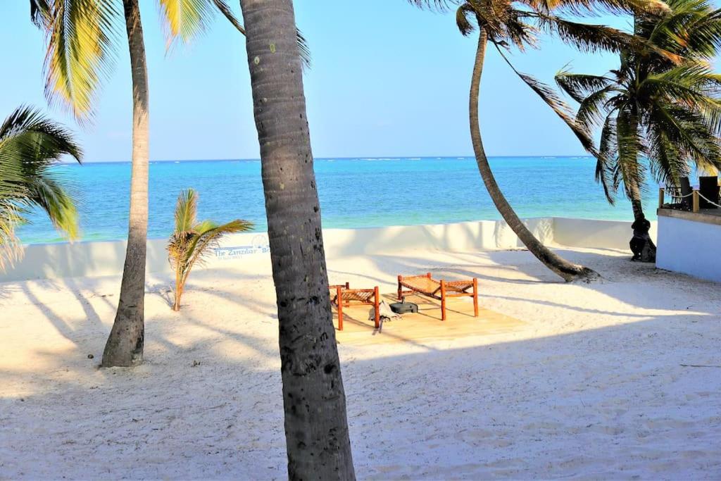 After trekking through mountain forests, many travelers choose to relax on the beautiful beaches of Zanzibar.

