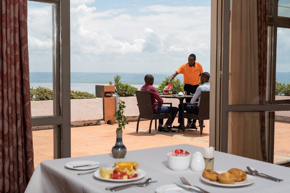 Dining at Nyagasambu Realm Hotel is an enjoyable part of every guest's stay, offering a wonderful blend of authentic Rwandan flavors and carefully prepared international cuisine. The hotel's restaurant emphasizes fresh ingredients, quality preparation, and attentive service, ensuring that every meal complements the overall hospitality experience. Whether guests are enjoying breakfast before an early safari departure, a relaxing lunch after sightseeing, or an elegant evening dinner, the restaurant provides a welcoming atmosphere where delicious food brings people together.