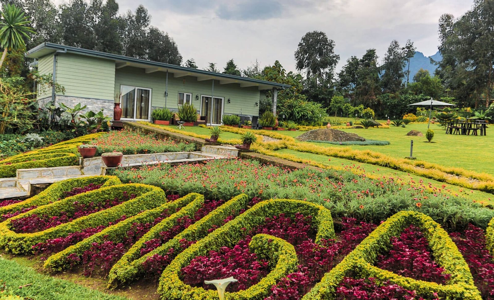 The architecture of Amakoro Songa Lodge is a beautiful expression of contemporary African luxury, thoughtfully designed to blend harmoniously with Rwanda's volcanic landscape while celebrating the country's rich cultural heritage. Every structure has been positioned to maximize privacy, breathtaking mountain views, and seamless integration with the surrounding environment, creating a lodge that feels both sophisticated and naturally connected to its spectacular setting.
