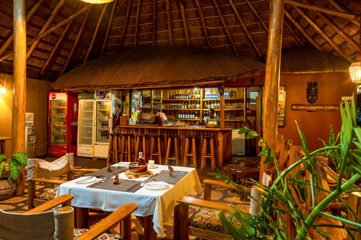 Dining at Chimpanzee Lodge is a delightful experience that combines fresh local ingredients, international cuisine, and the warm hospitality for which Rwanda is renowned. The lodge's restaurant overlooks the surrounding rainforest and rolling hills, creating a peaceful atmosphere where every meal is accompanied by spectacular natural scenery.