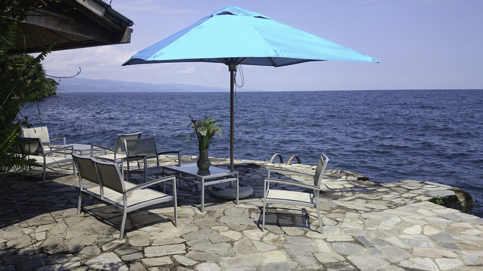 The architecture of Kivu Lodge has been thoughtfully designed to complement the natural beauty of Lake Kivu while providing guests with exceptional comfort and uninterrupted panoramic views. The property blends contemporary design with traditional Rwandan influences, creating an elegant yet welcoming atmosphere throughout the lodge.