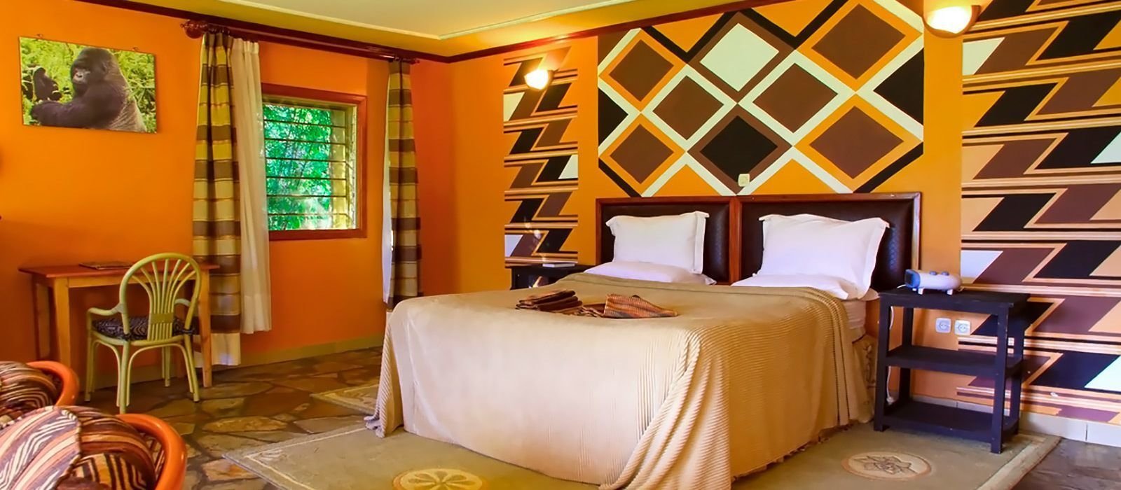 The lodge has been carefully designed to blend naturally with its volcanic surroundings, using local building materials and craftsmanship that reflect Rwanda's rich architectural heritage.
